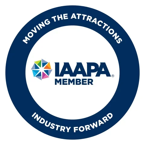 Logo of IAAPA Member with the slogan 'Moving the Attractions Industry Forward' on a circular blue background.