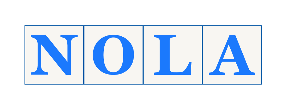 Street tiles spelling out 'NOLA' in blue letters on white background.