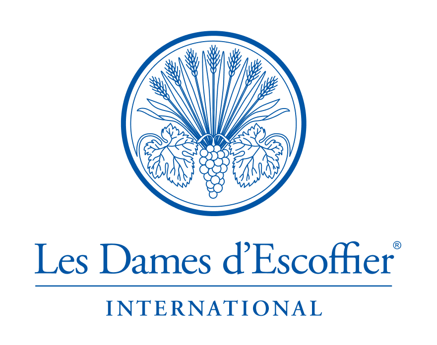 Blue stacked logo of Les Dames d'Escoffier International featuring a grapevine and wheat motif.