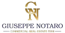 A stylized golden key with a circular head. The key is decorated with a blue and green globe inside the circular part of the head. Below the key, there is text that appears to relate to a website or organization.