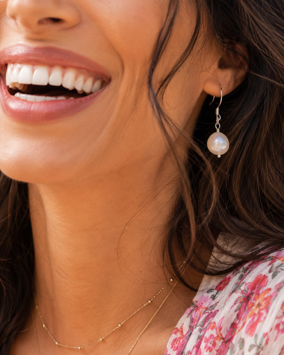 close up pearl ear smile.png