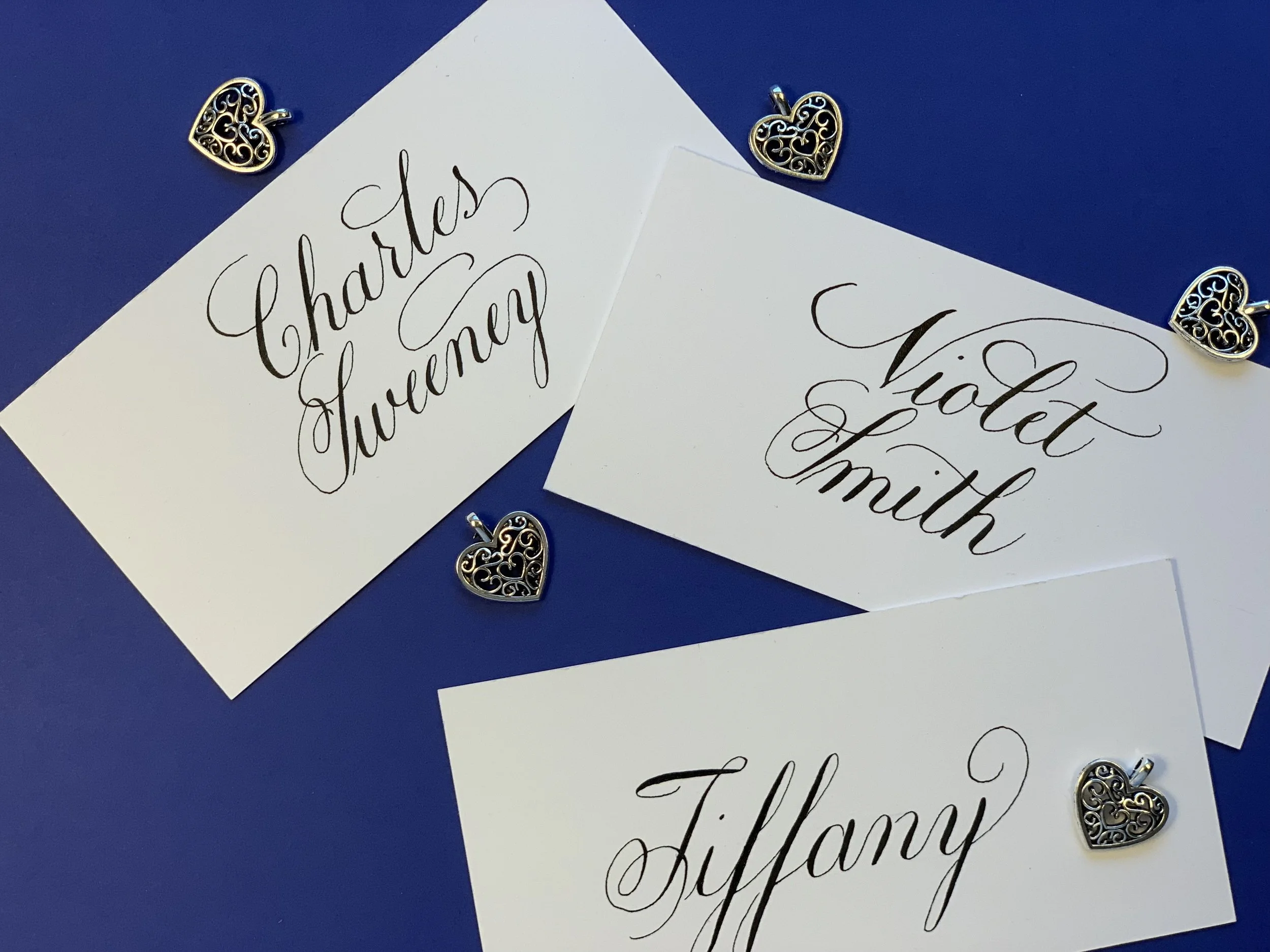 Custom handwritten calligraphy place cards with first name or full name for wedding, party, or special event.