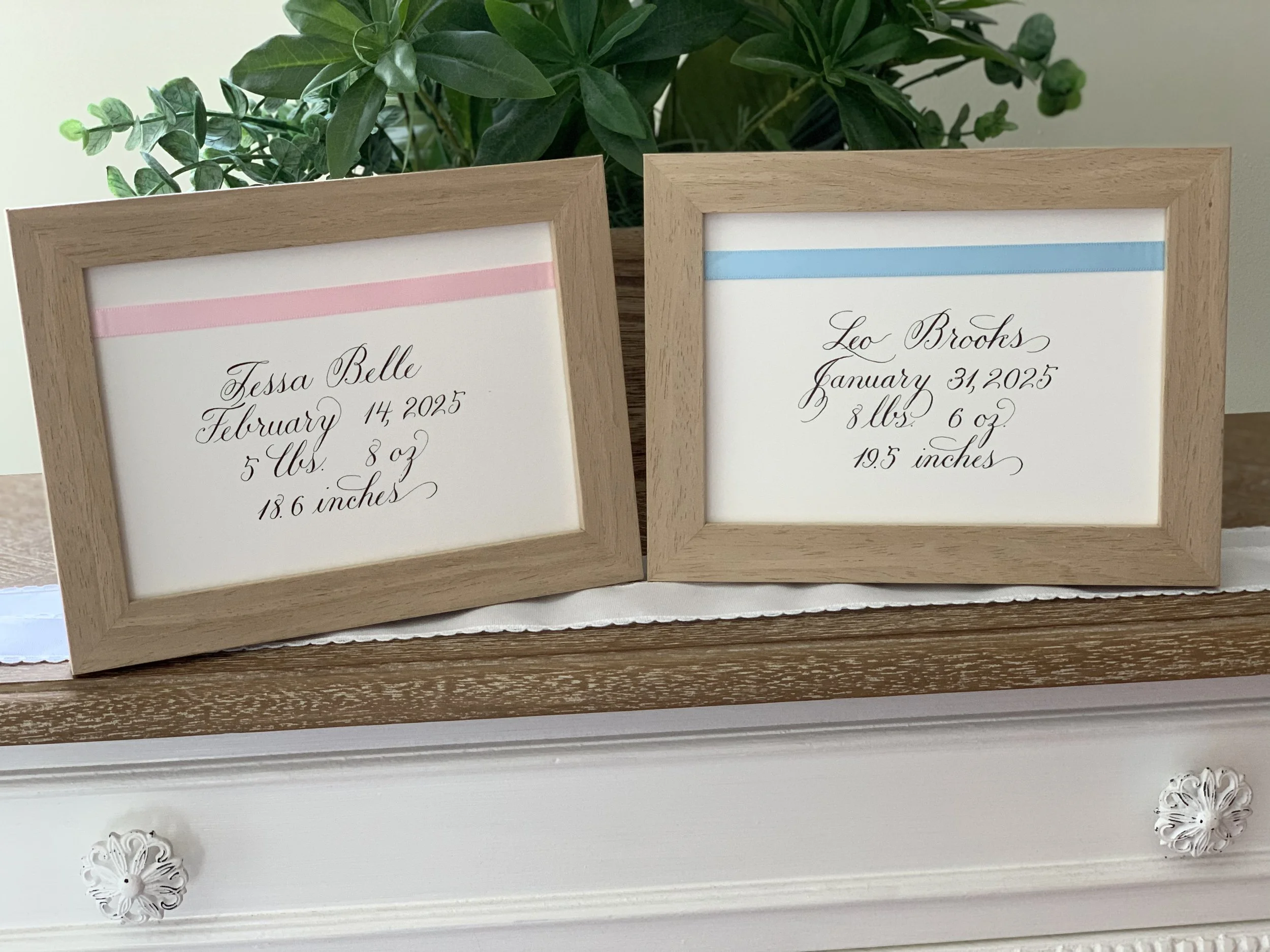 Baby name and statistics in custom calligraphy in wooden frame  with ribbon for baby gift or nursery decor.