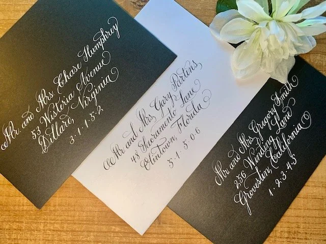 Elegant calligraphy on wedding envelopes with handwritten addresses for party, wedding, or events.