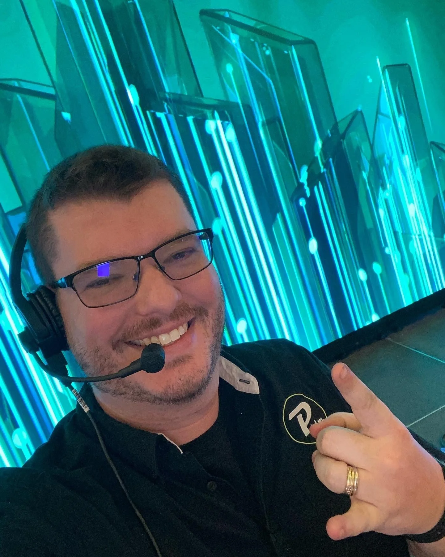 Jacob on comms in front of the LED wall before doors