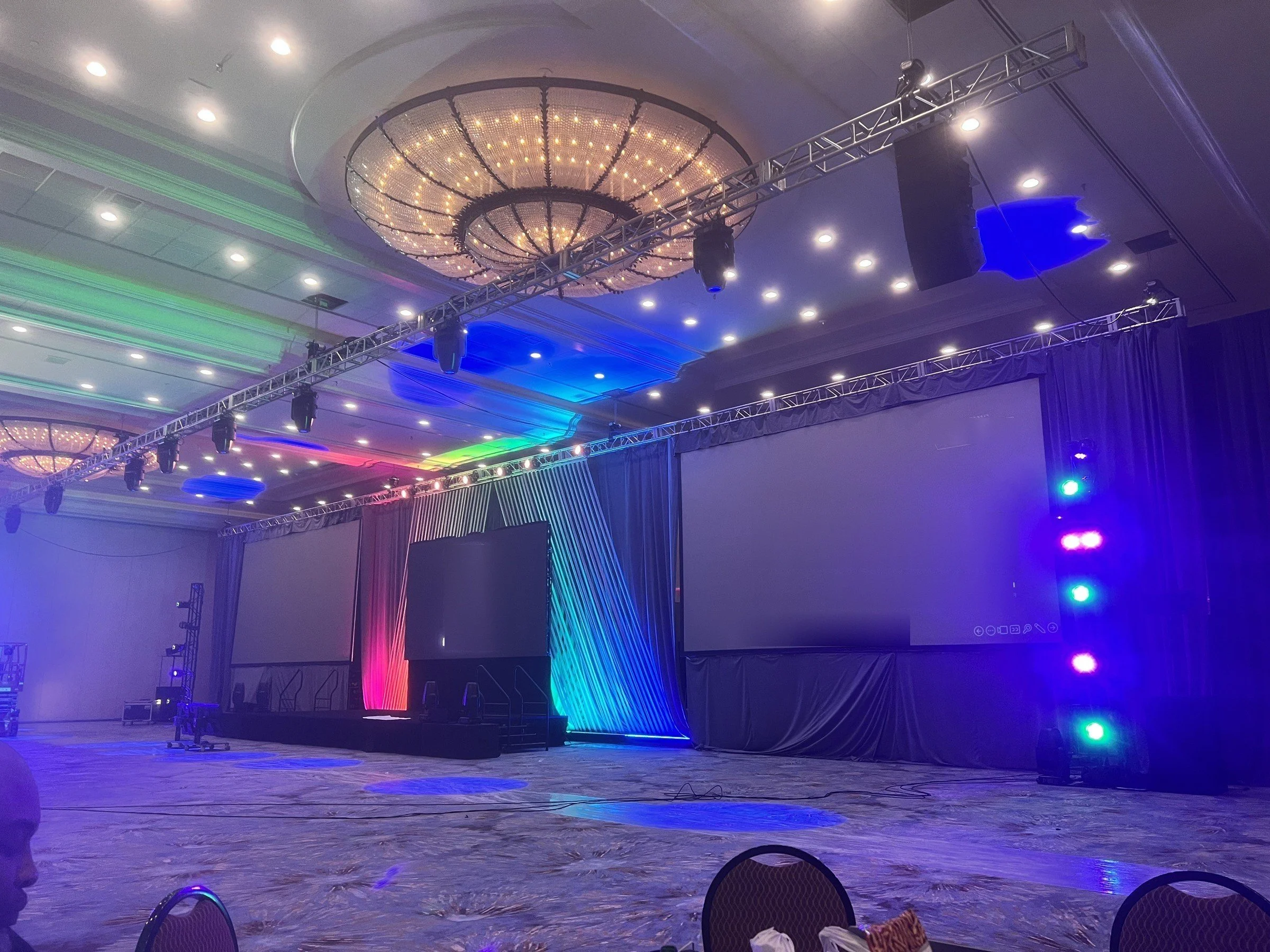 Ballroom summit: pixel drape scenic, center LED and dual projection screens