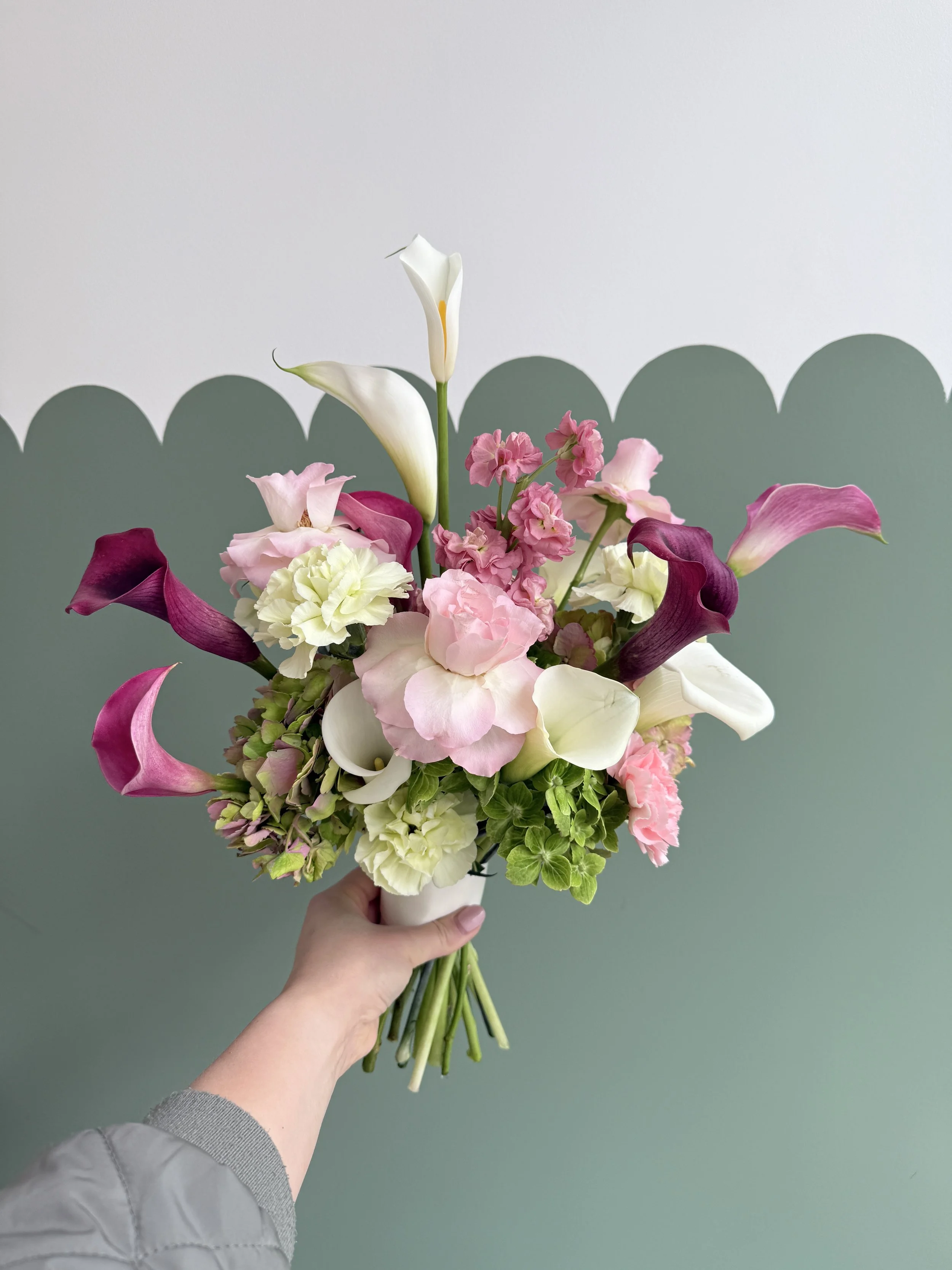 Modern and structures with bold flower choices such as Cala Lillies, reflexed Roses, Hydrangeas and Stocks