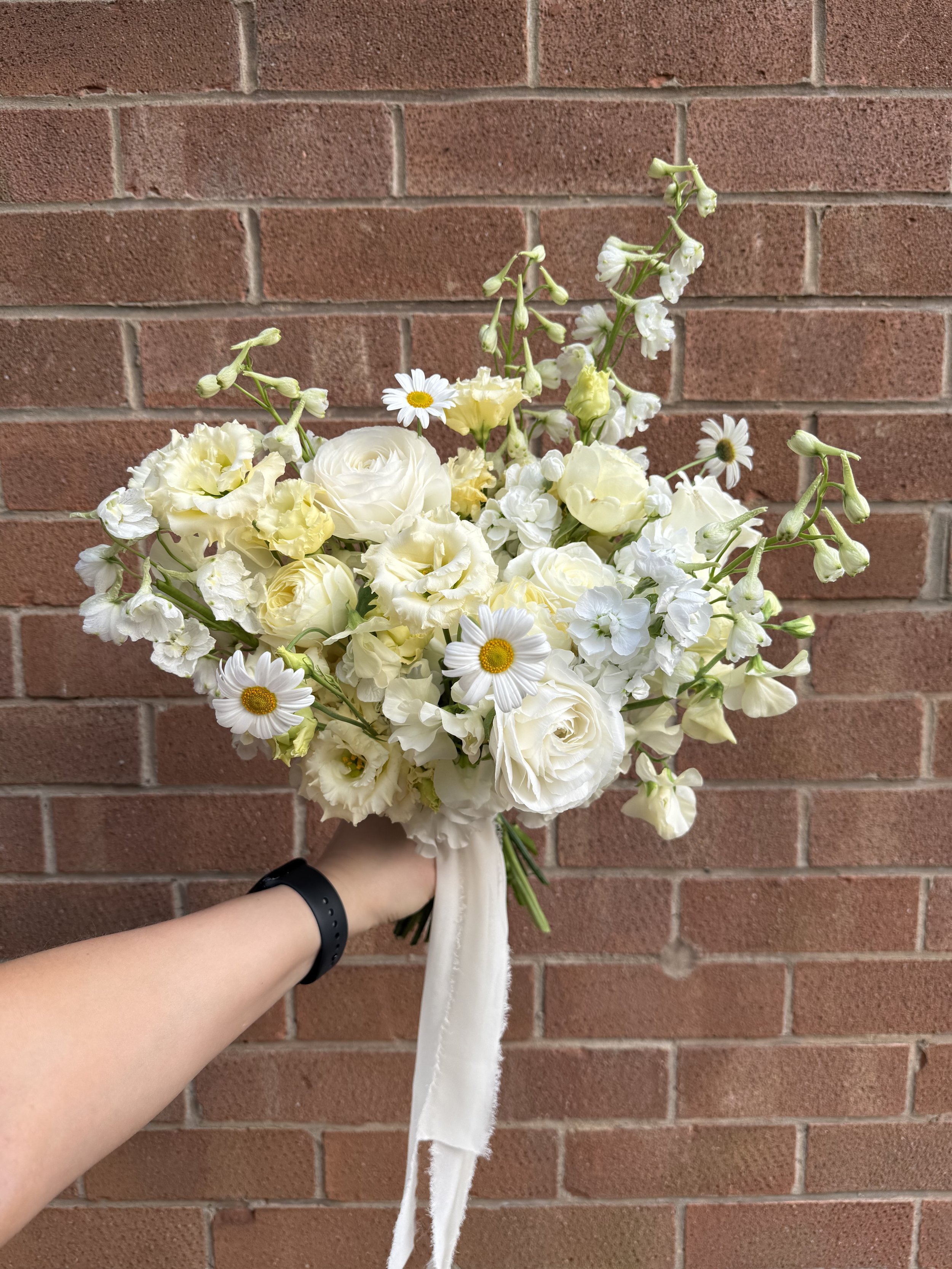 Butter-yellow, full-floral with garden roses, Delphinium and Lisianthus