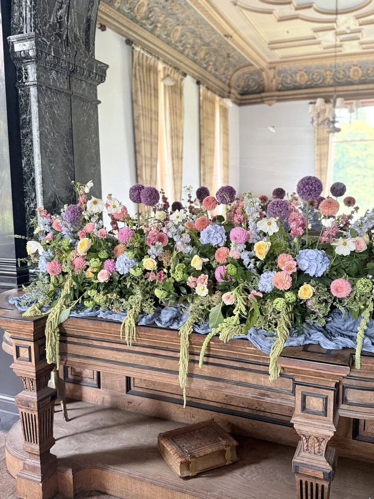 Large summer mantlepiece floral installation at Springkell House, Dumfries and Galloway. 