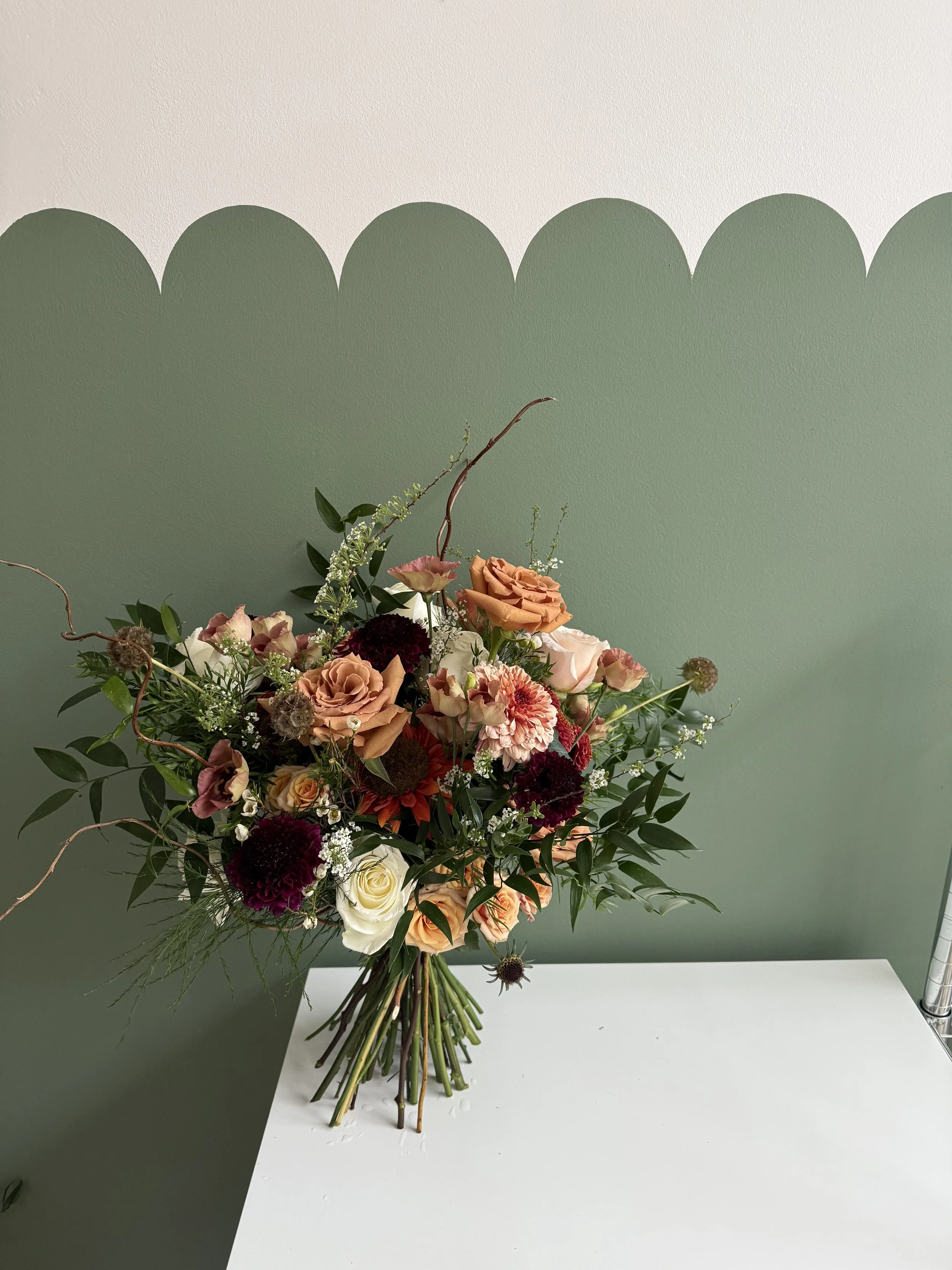 Full, autumnal with foliage, Toffee Roses and Burgduny Scabious