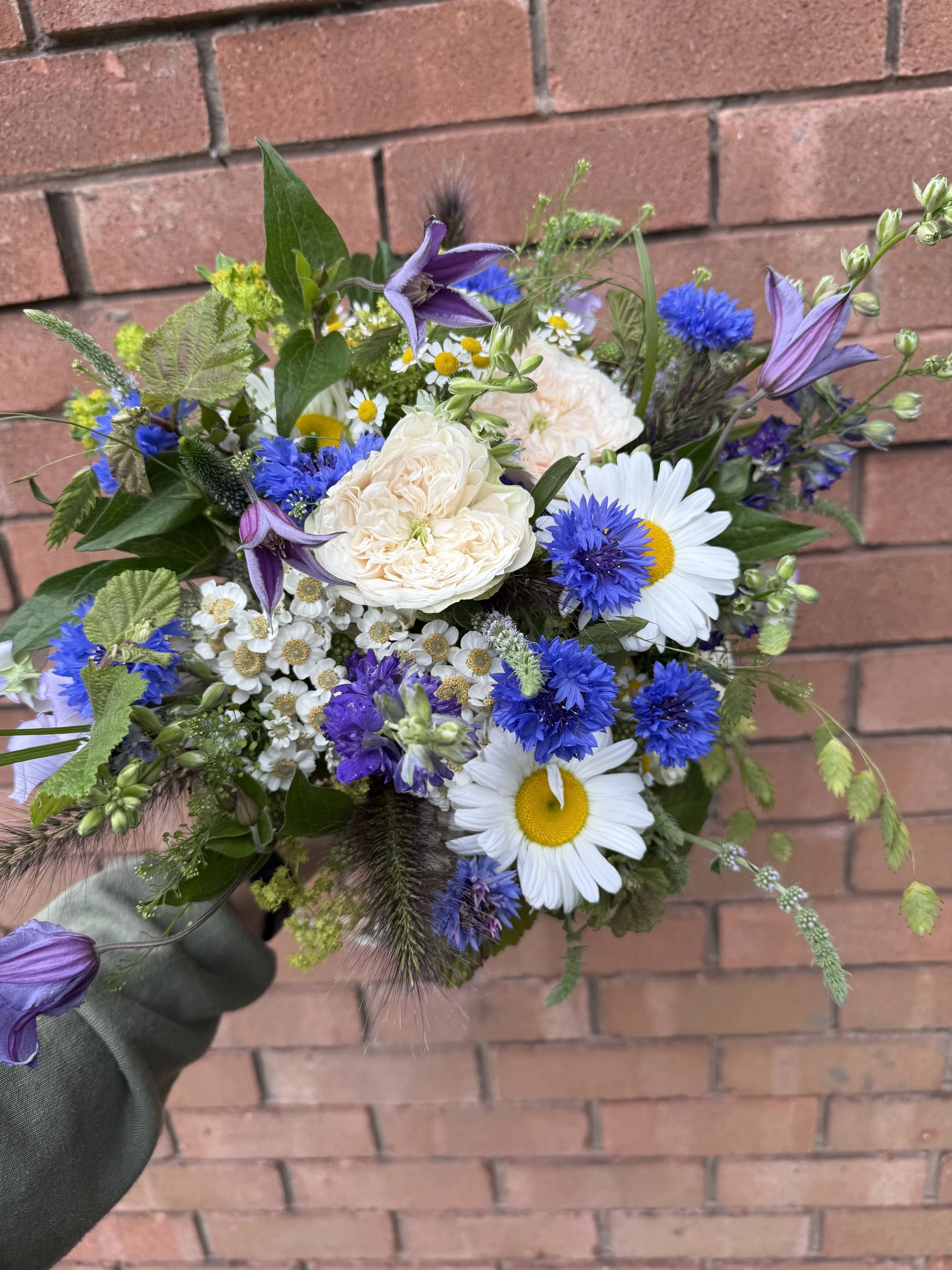 Garden inspired with pops of blue Cornflowers, blush garden Roses, Daisies and Clematis