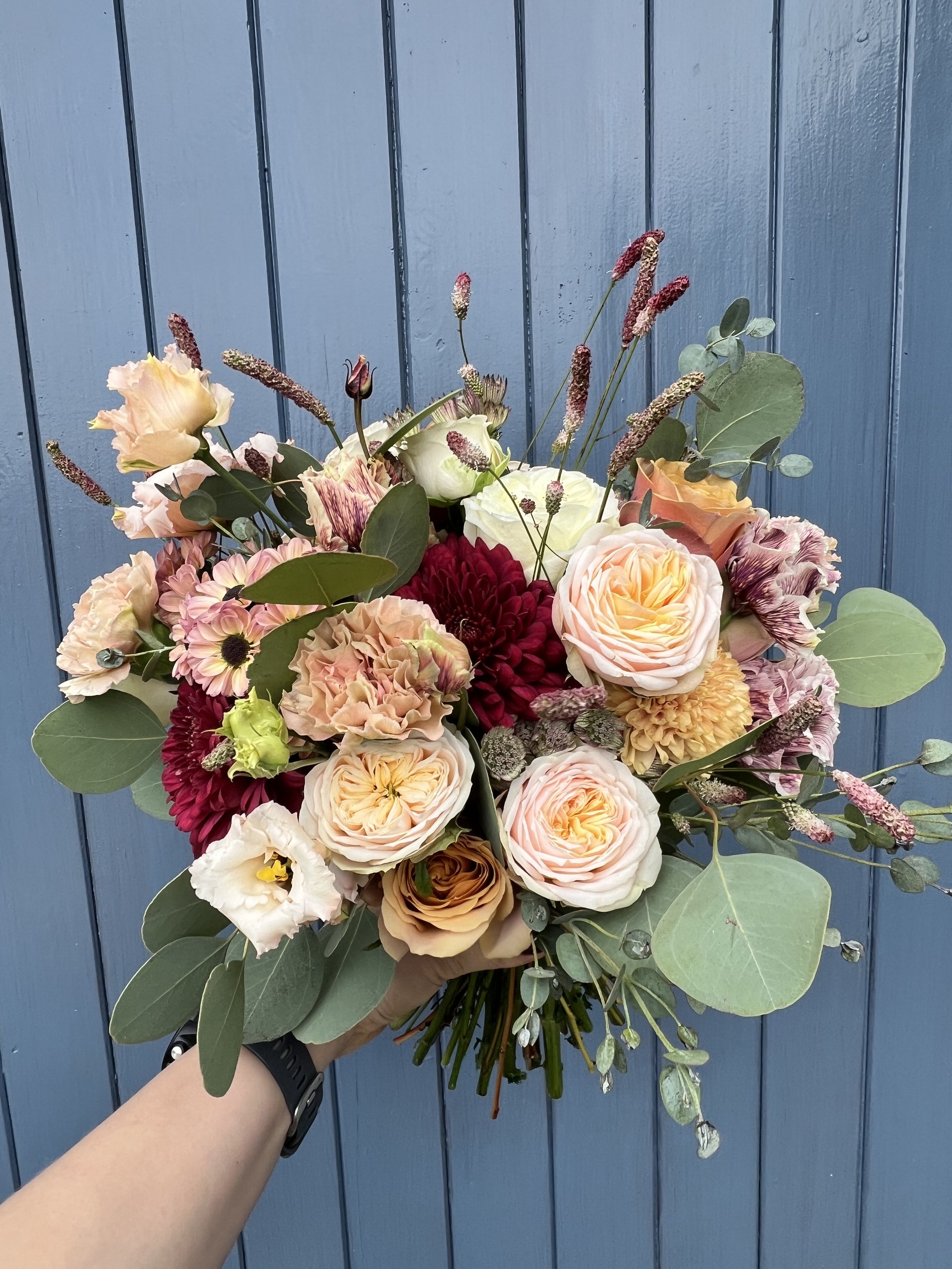 Burgundy, salmon and sunset pink late-Summer bouquet