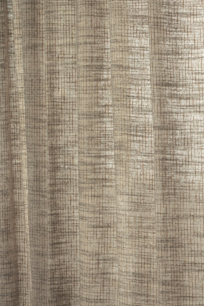 A beige curtain with a grid pattern of thin reddish-brown lines.