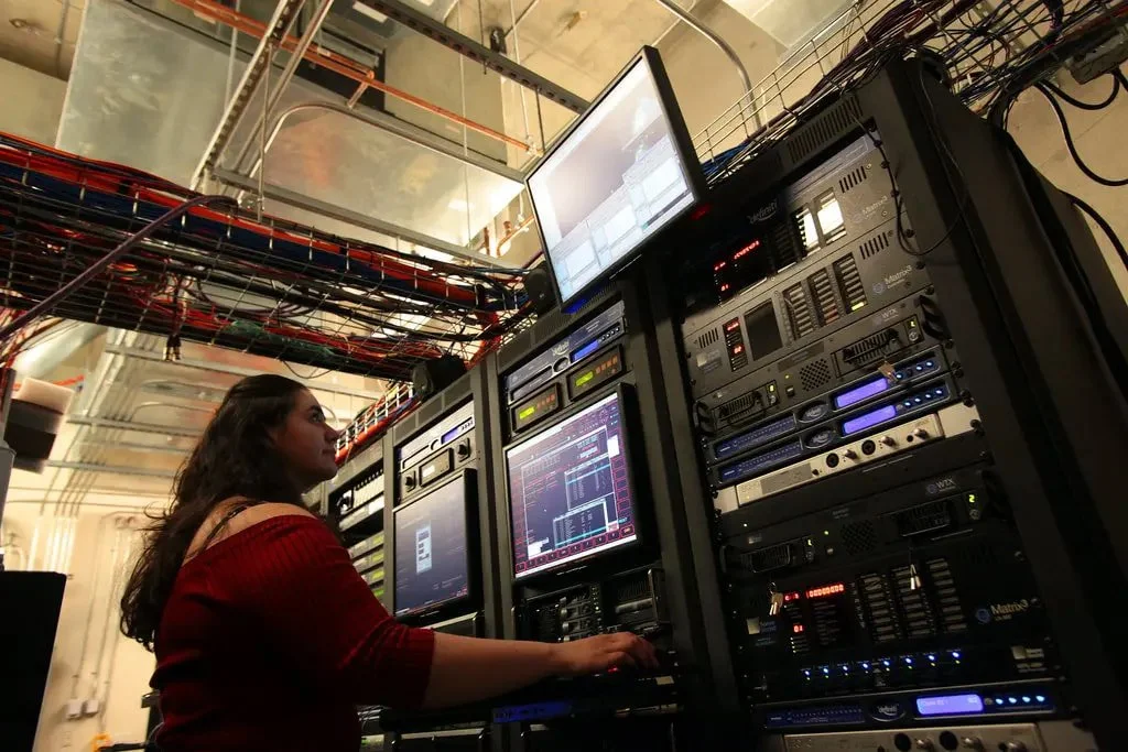 New York Times Article: Behind the Scenes of Fulldome Show Production  |  Cheryl Vanderbilt in the Planetarium systems control room 2011.