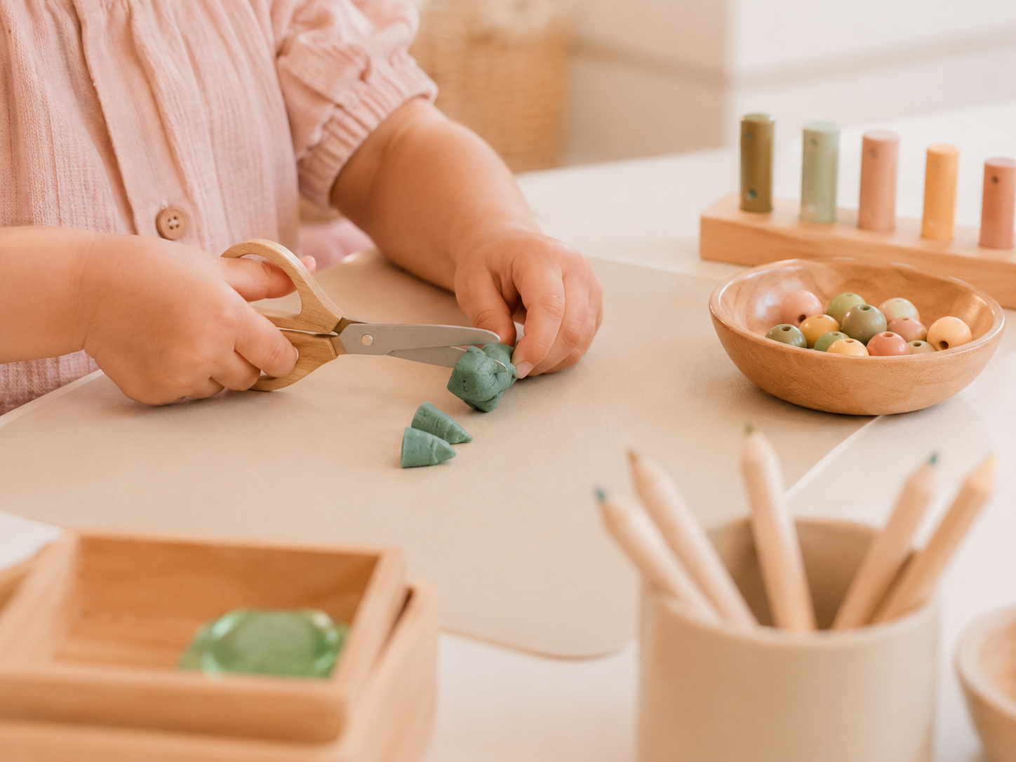 Child practising fine-motor and scissor skills during a paediatric occupational therapy activity