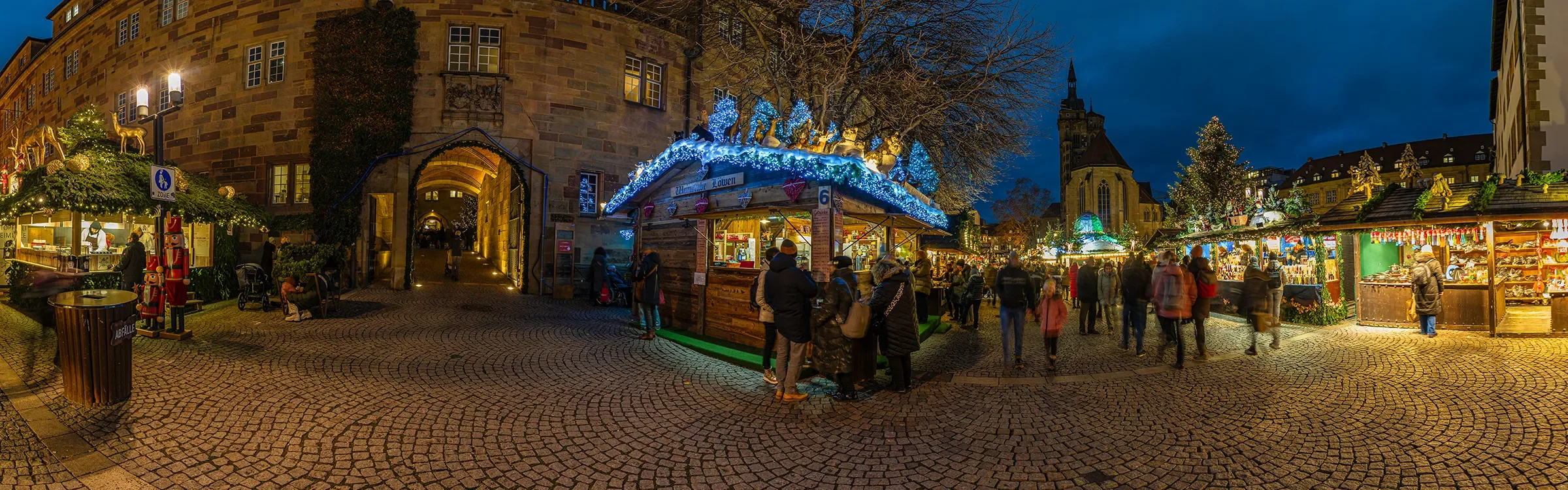 Panoramic evening view of the Stuttgart Christmas Market in Germany, representing ImmerseMe's immersive German language learning experiences inspired by authentic German culture and real-world locations.