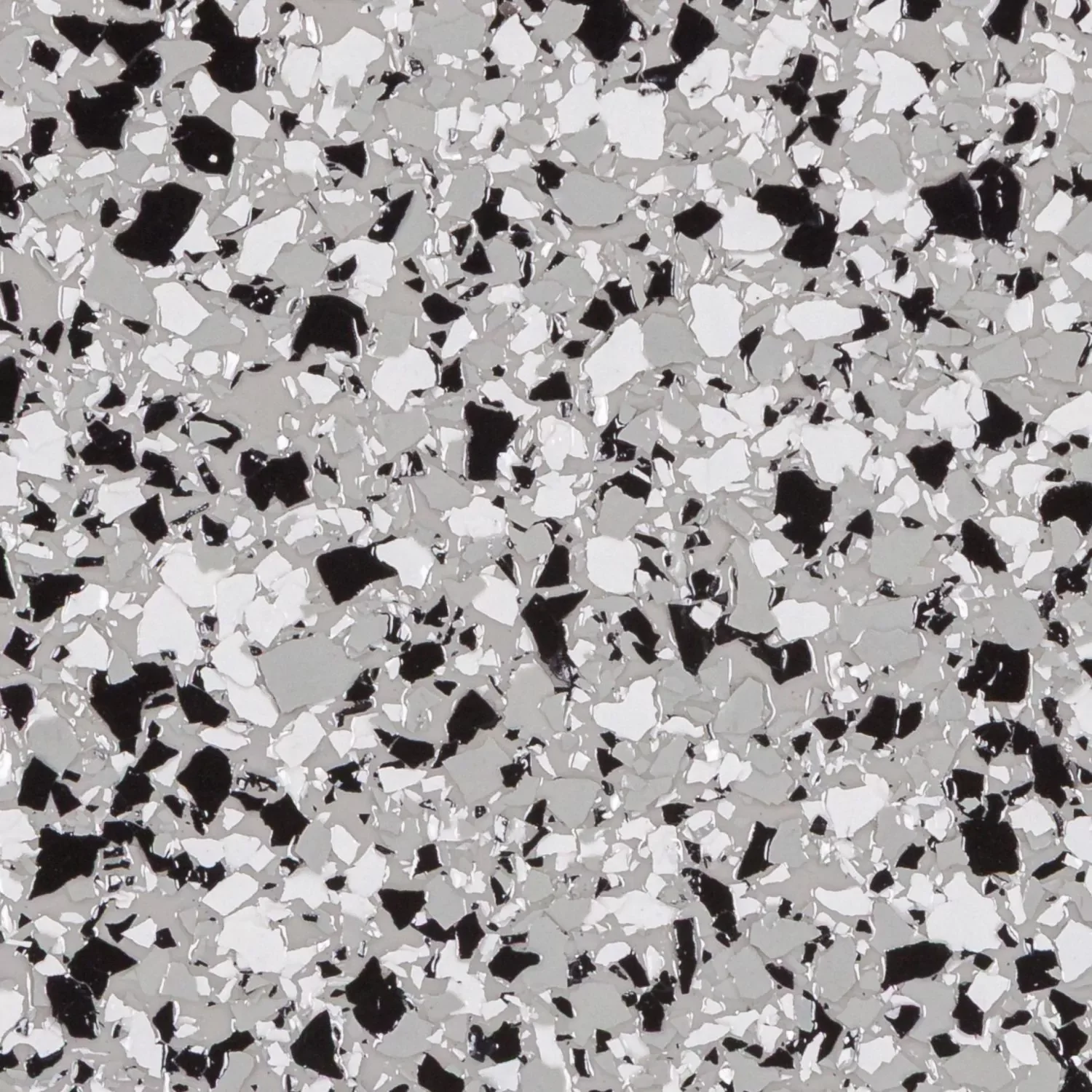 Close-up of a flooring with black, white, and gray flecks.