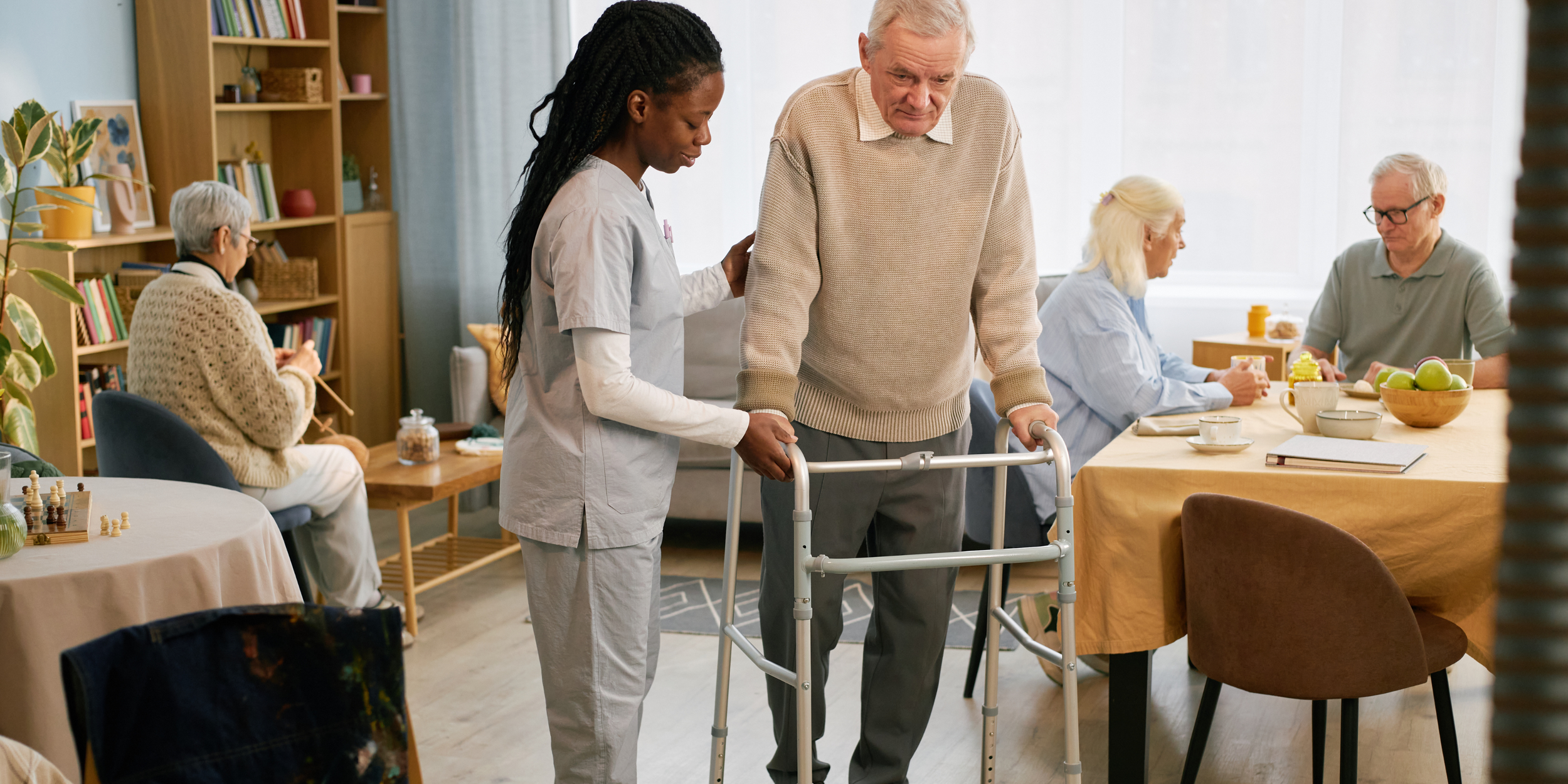 a melbourne based physiotherapist helping an aged care resident at home