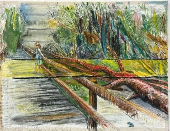 A child standing on a wooden bridge with a fallen tree across it, near a staircase and surrounded by trees and greenery.