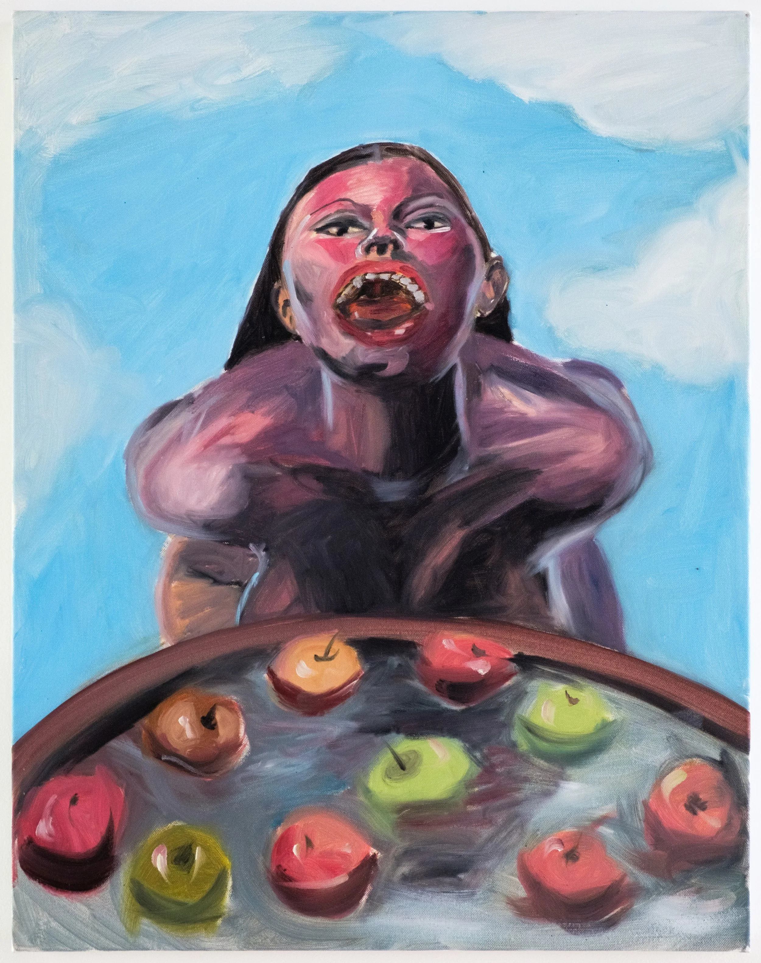 A colorful painting of a woman with dark hair, red and pink tones on her face, wide open mouth, and expressive eyes, sitting at a table with a variety of colorful fruits including apples, and a bright blue sky background.