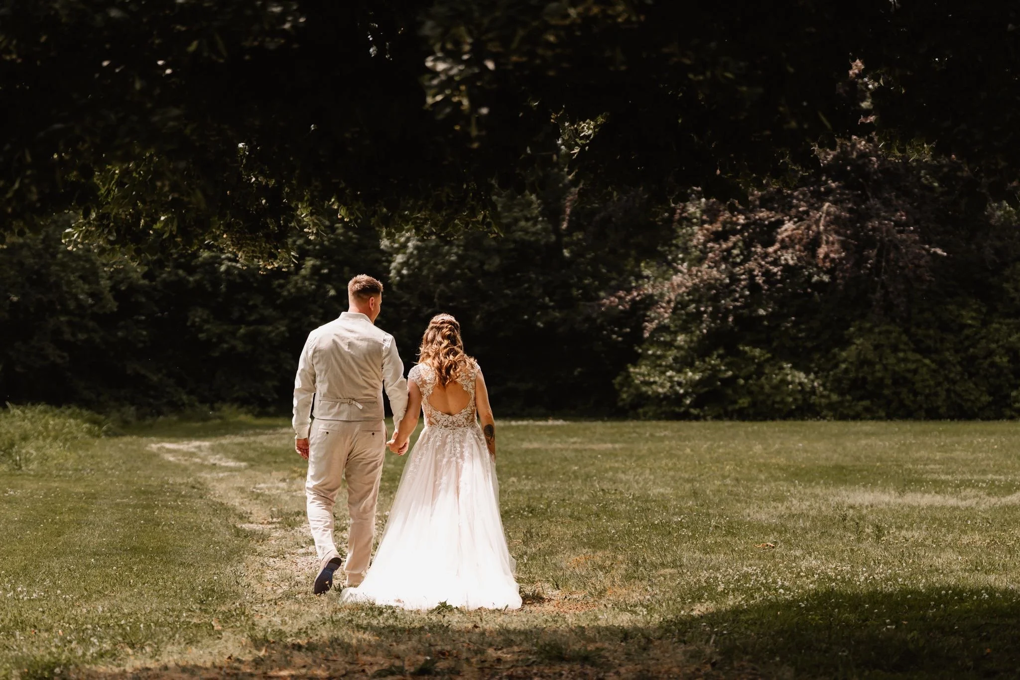 Laurie’s customers, Larissa and Emmett, just married walking off the aisle together.