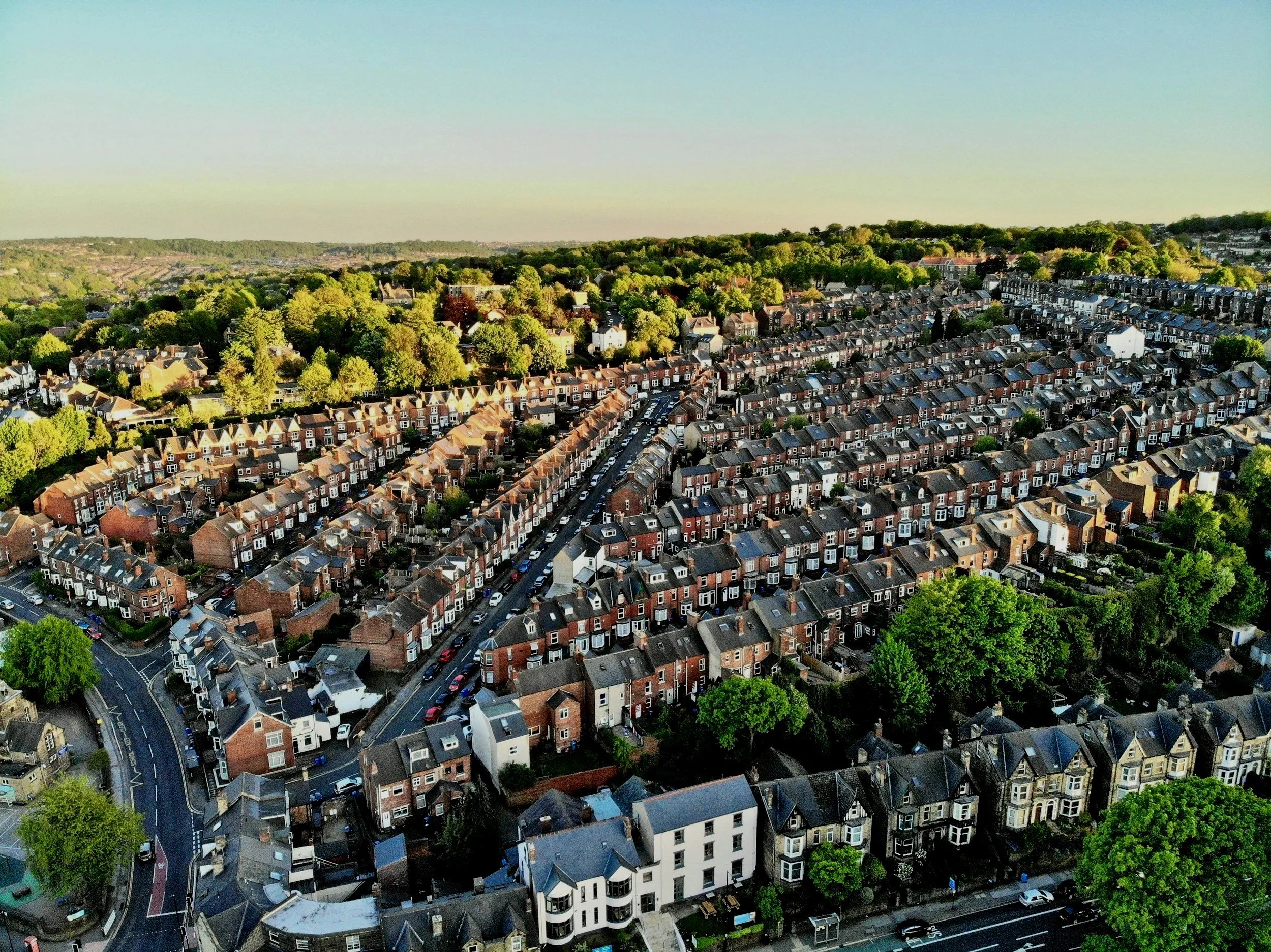 Aerial view of UK residential streets showing rows of terraced houses, representing the type of domestic properties requiring Energy Performance Certificates