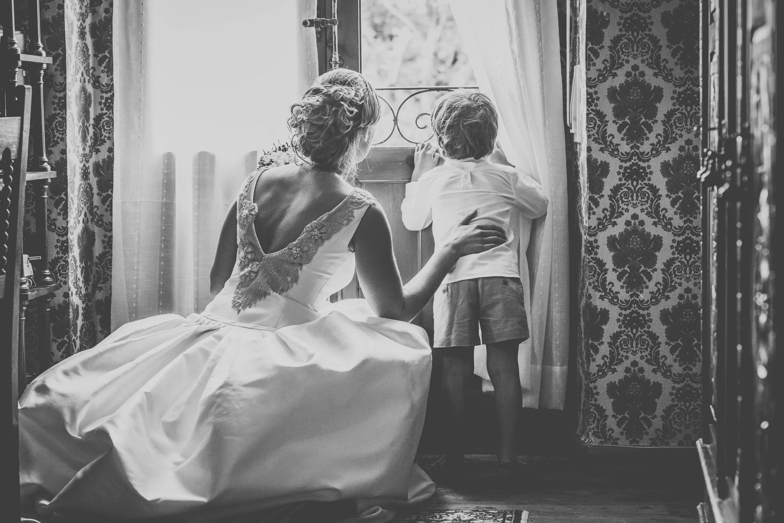 Bride and groom exchange vows on a green cliff overlooking the Asturian coast.
