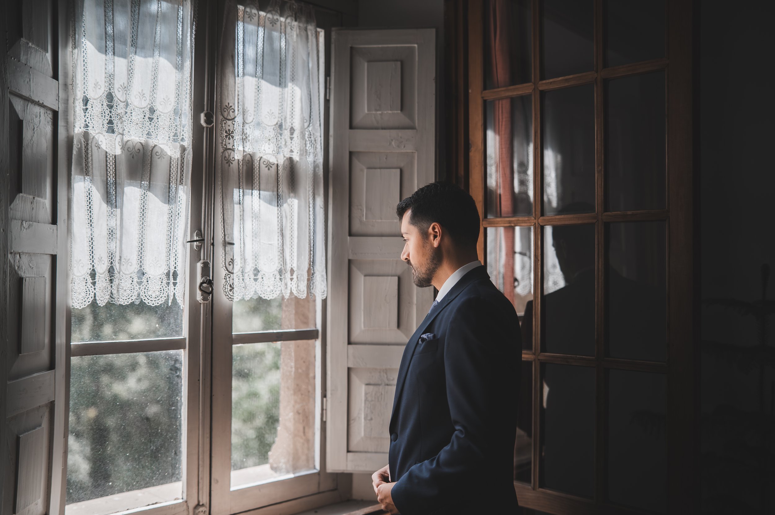 Groom's emotional reaction seeing his bride for the first time before the ceremony.