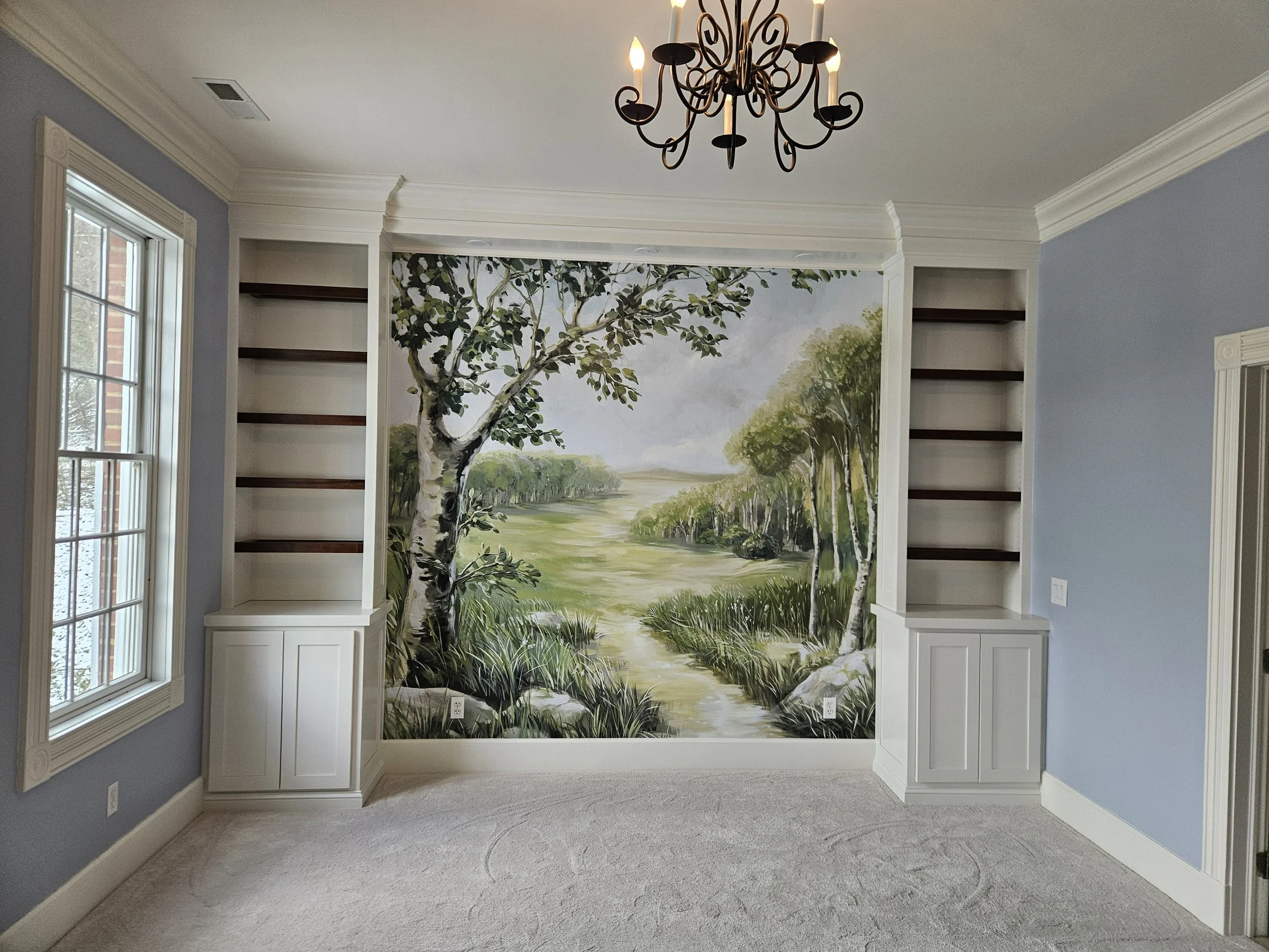 In this project we installed crown molding and built in cabinets.