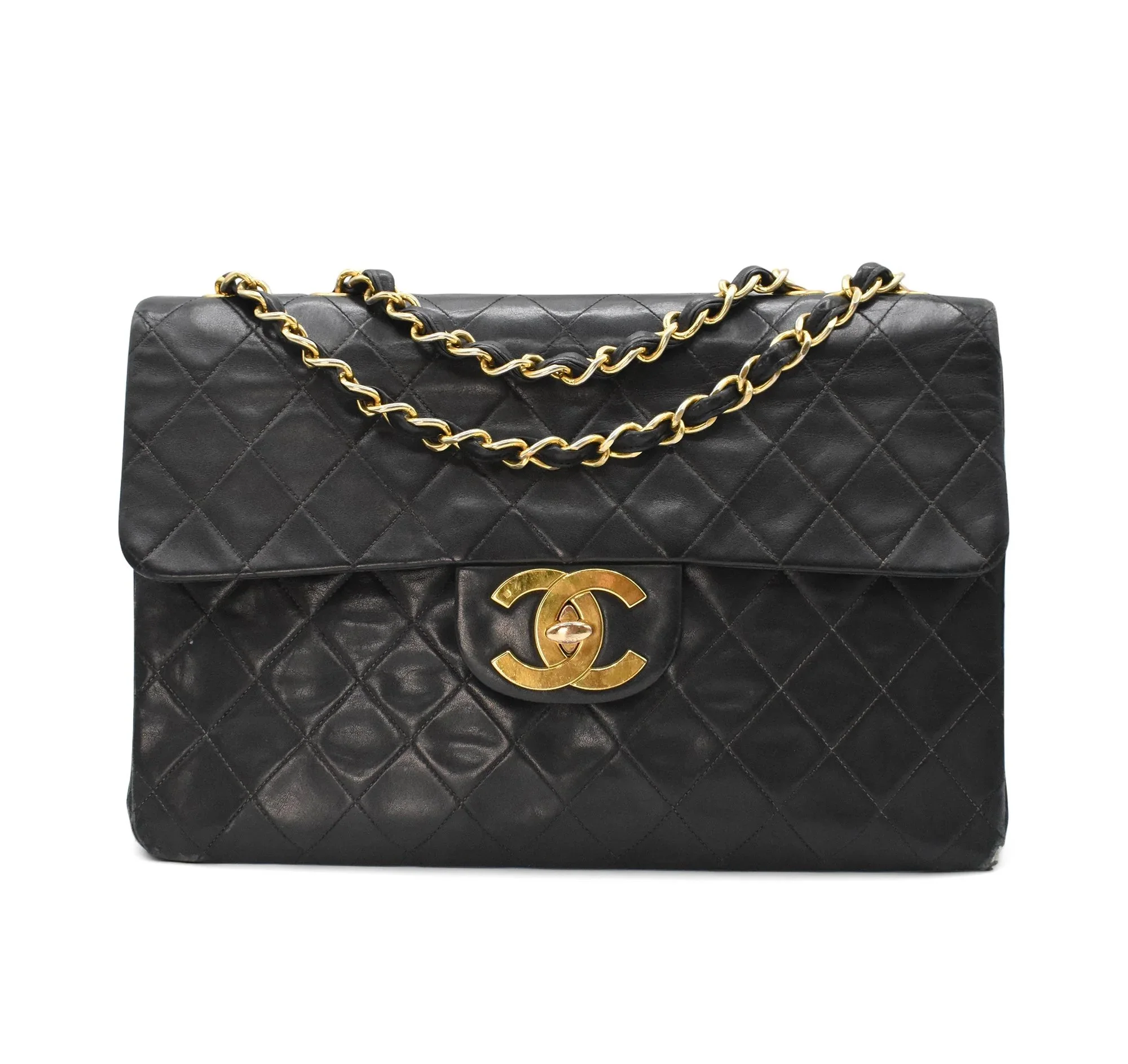 Authentic vintage Chanel Posh Bag showing classic soft lambskin quilting and oversized CC lock⁠