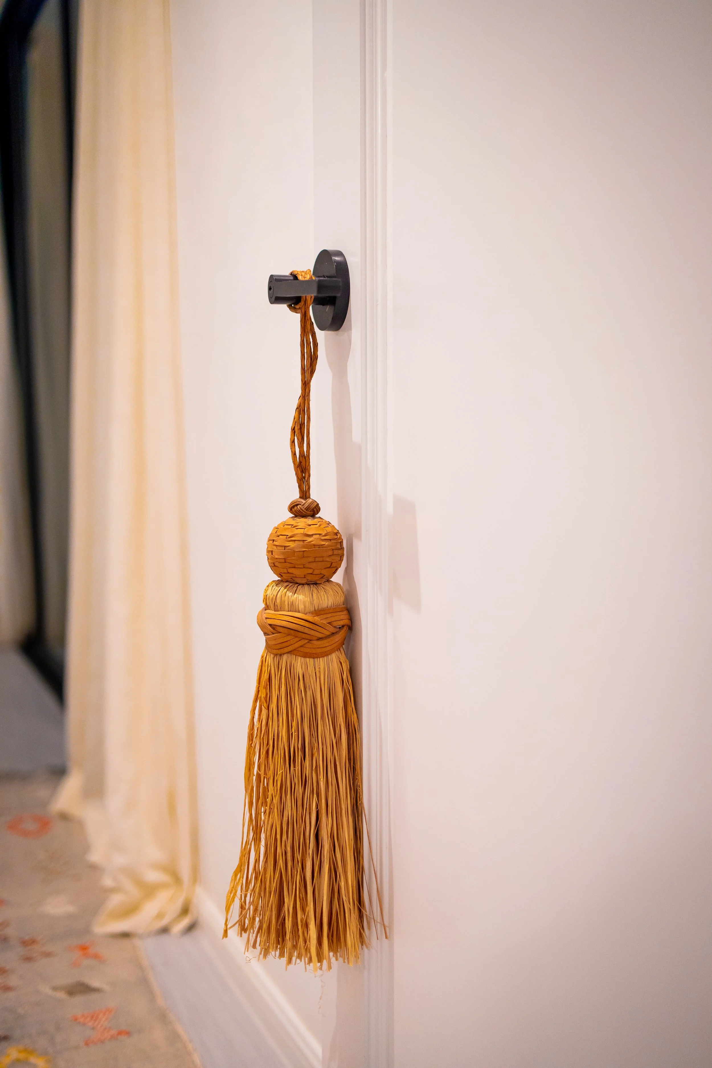 The details no one asked for, and everyone notices — handwoven rattan, door by door