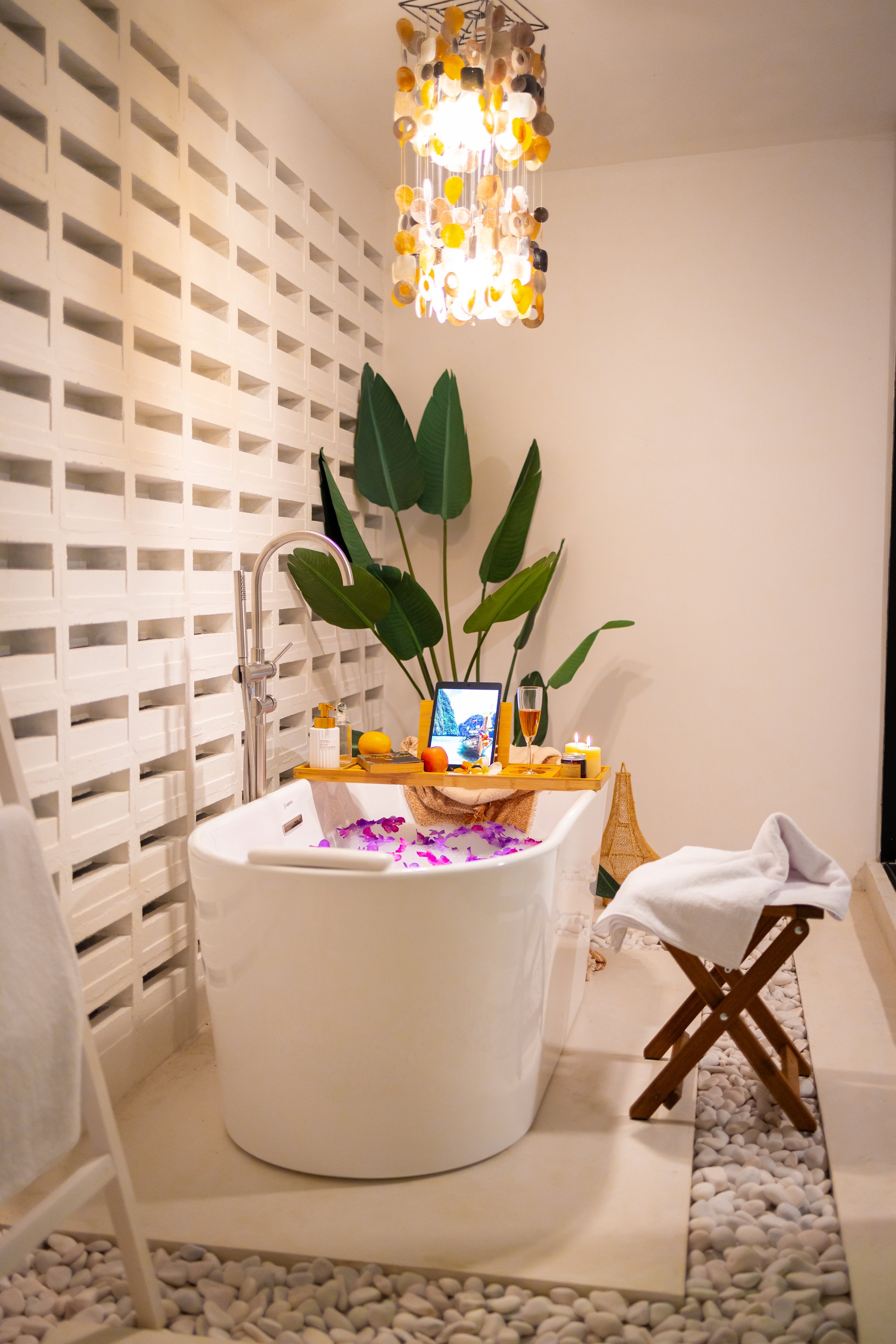 Indoor sanctuary with capiz chandelier and glass partition