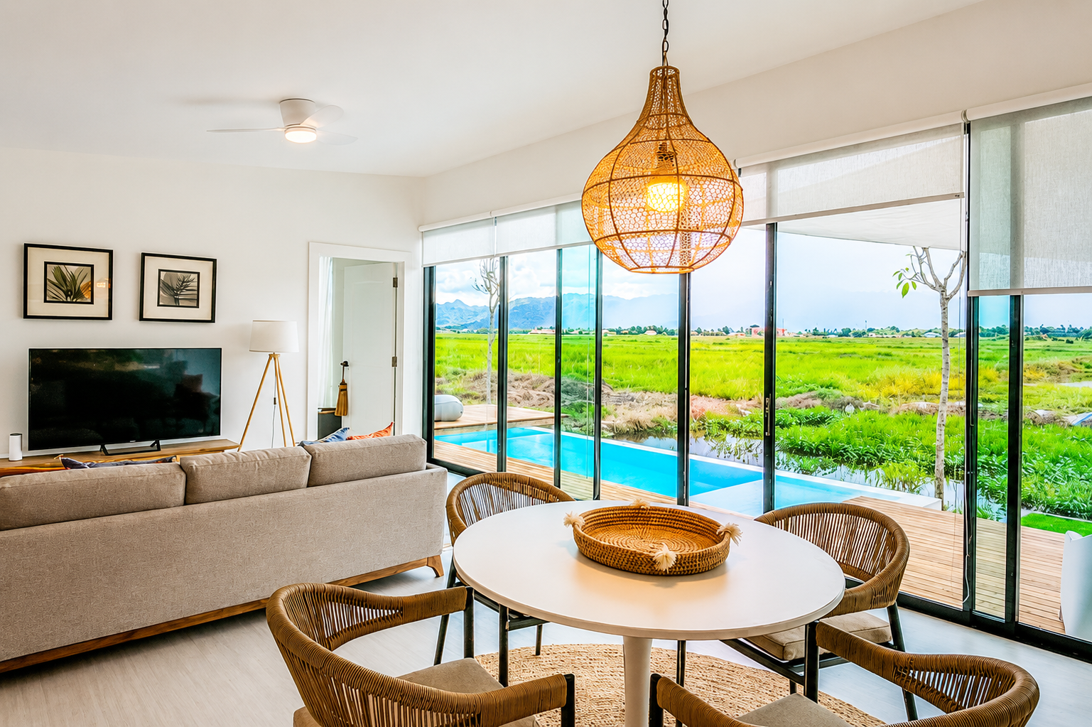 pen-plan living and dining at ULU Mahsuri Villa with pool and rice field views, Langkawi