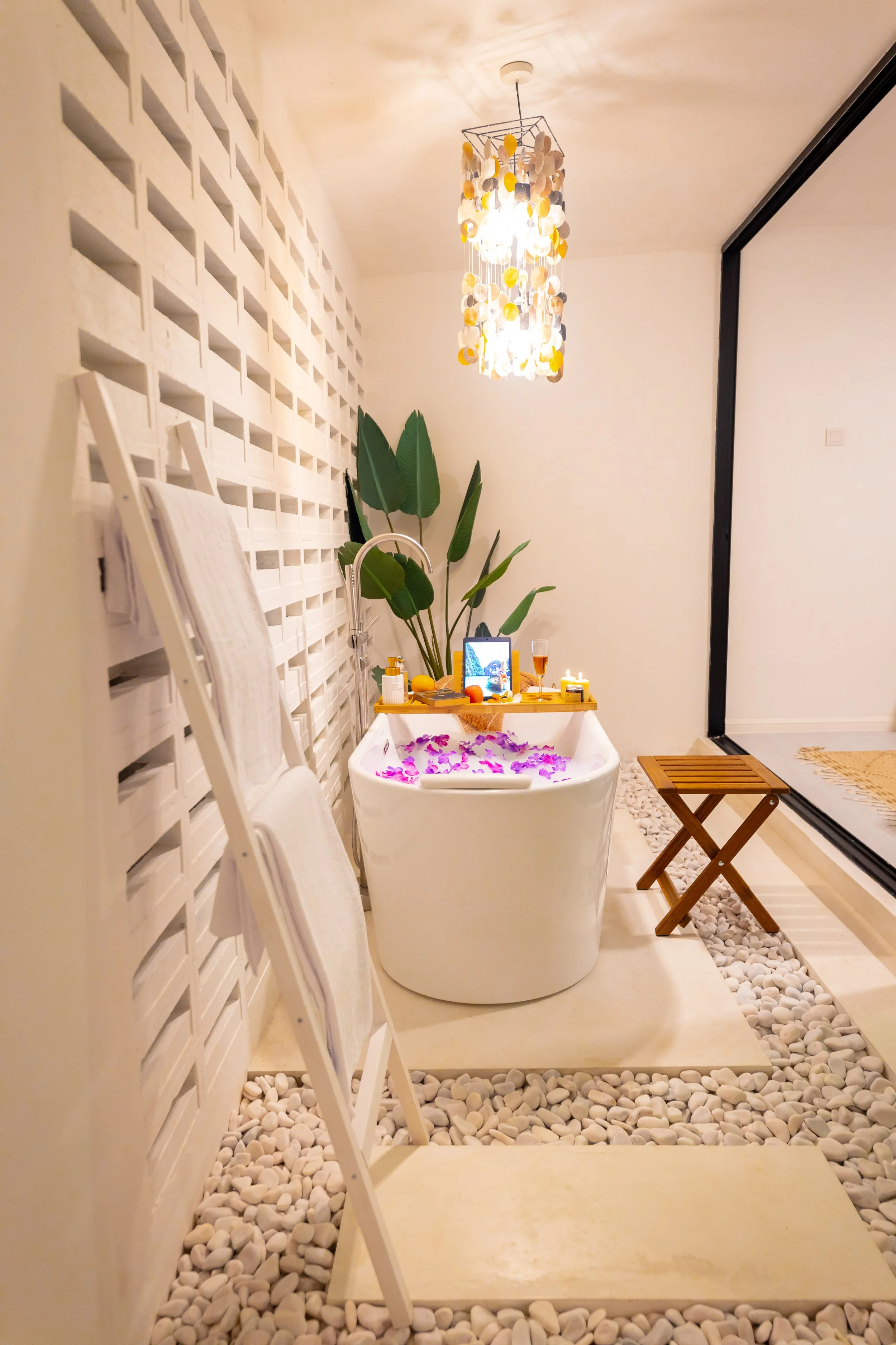 Indoor freestanding bath — petals, candles and complete solitude