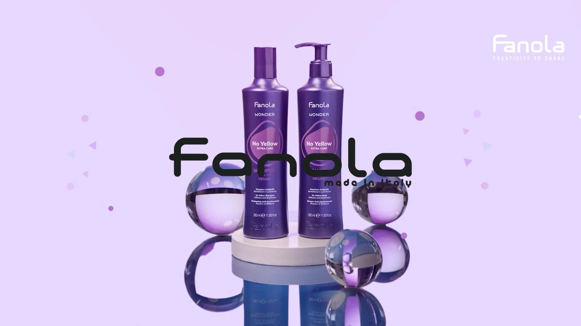 Display of Fanola Wonder No Yellow hair care products, including shampoo and conditioner, on a circular platform with decorative spheres, set against a light purple background with confetti-like shapes and the fanola logo in the top right corner.