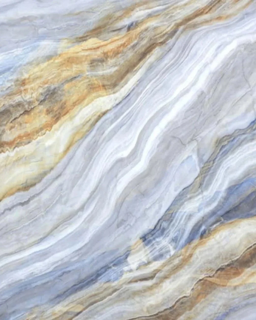 Close-up of a colorful, layered marble or stone surface with streaks of beige, gray, white, and hints of brown and blue.