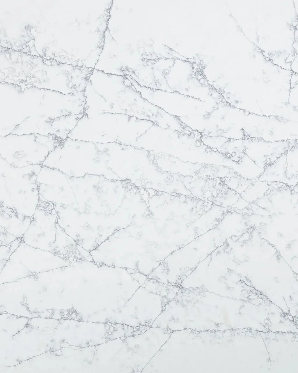 A white marble surface with gray veining.