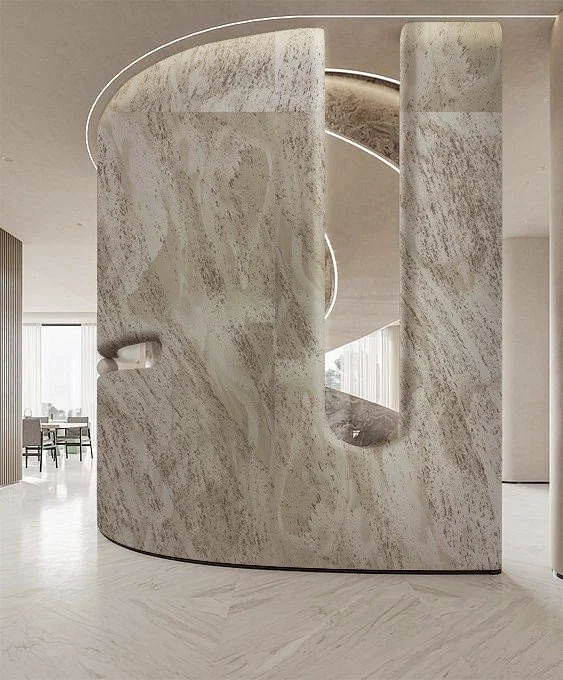 Modern interior with curved marble walls and an open doorway, minimalistic style.