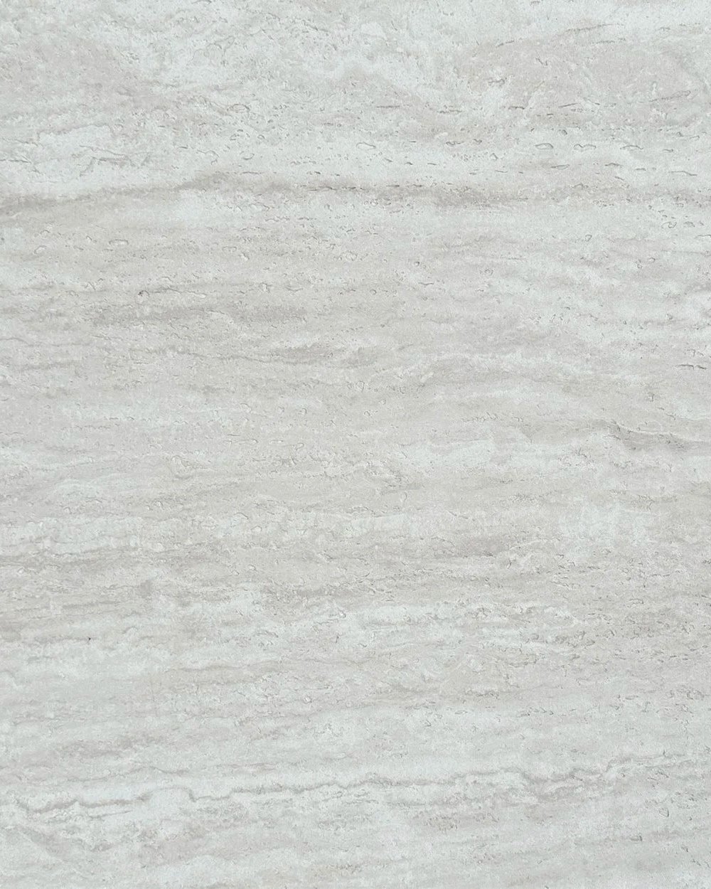Close-up of a light gray marble surface with subtle veining.