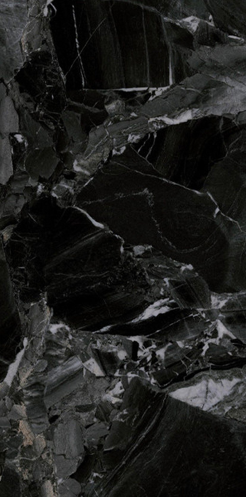 Close-up of black marble stone with white veining.