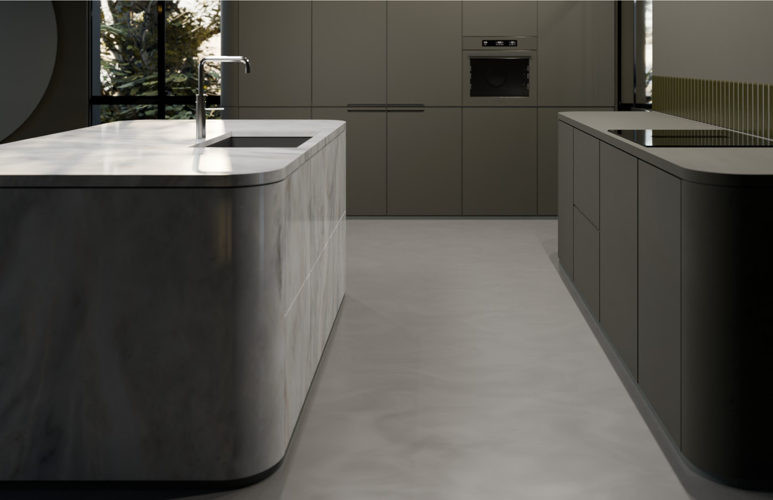 Modern kitchen with marble island, gray cabinets, and a built-in oven, featuring a large window with view of trees outside.