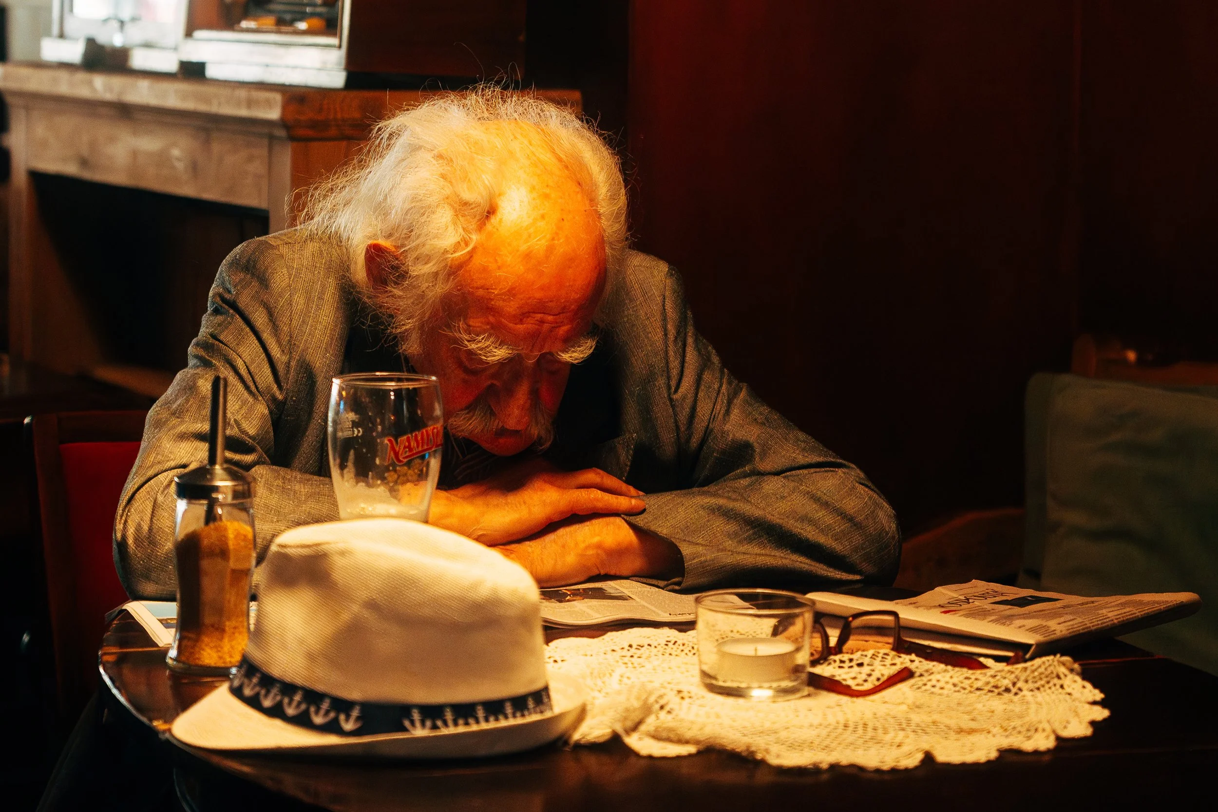 A documentary-style portrait capturing an authentic moment, rich in atmosphere and human character.
