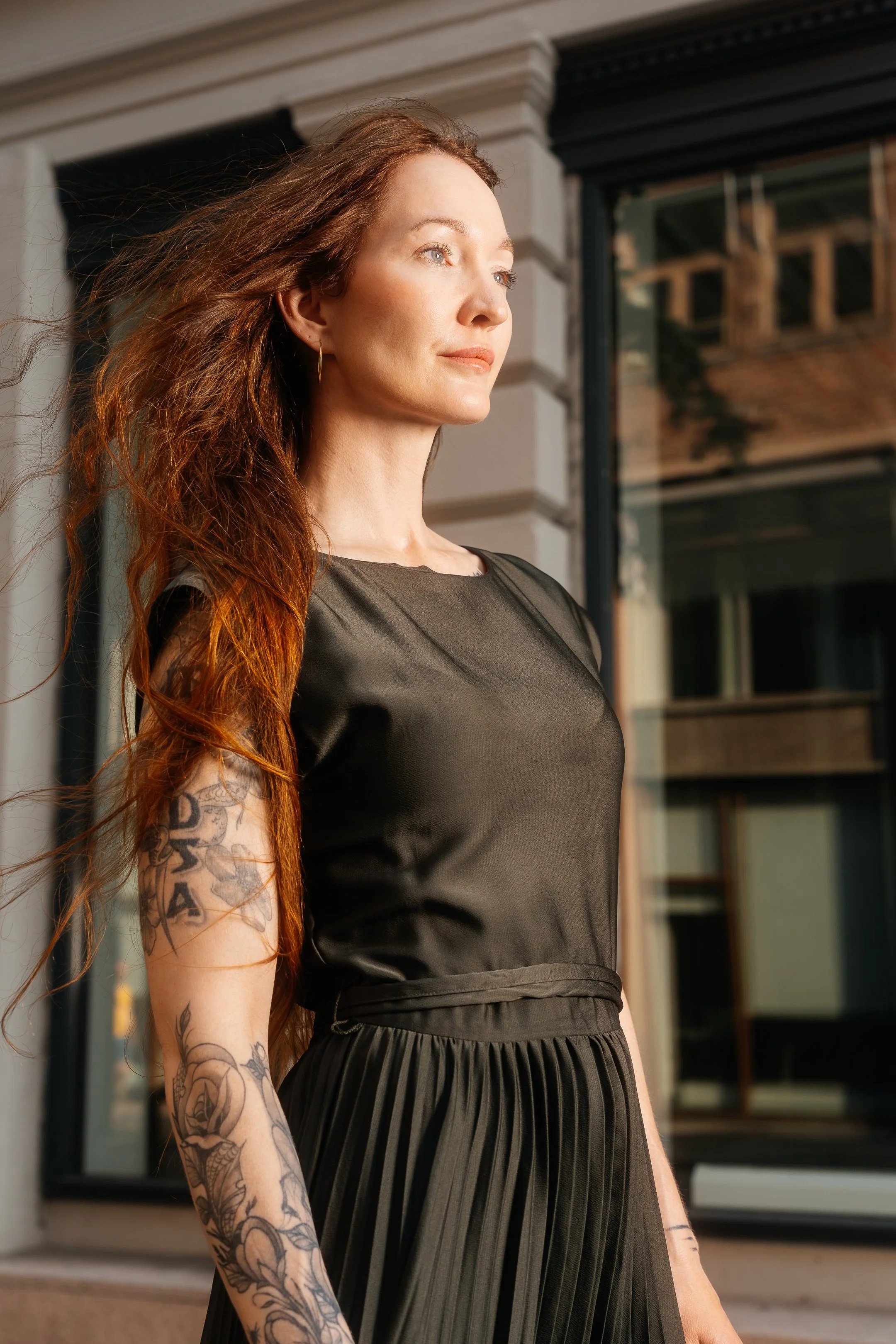 A relaxed portrait capturing a natural moment with an intimate, lifestyle-oriented feel.