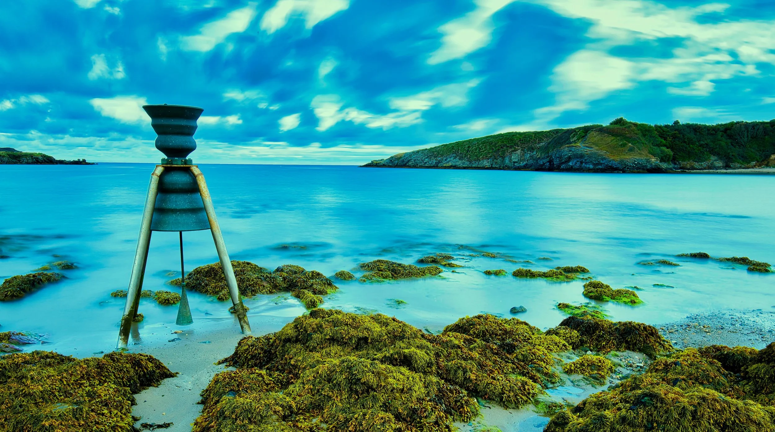 Image of the tidal bell at Cemaes Bay, Anglesey. This is a 120 long second exposure, blending sky and sea
