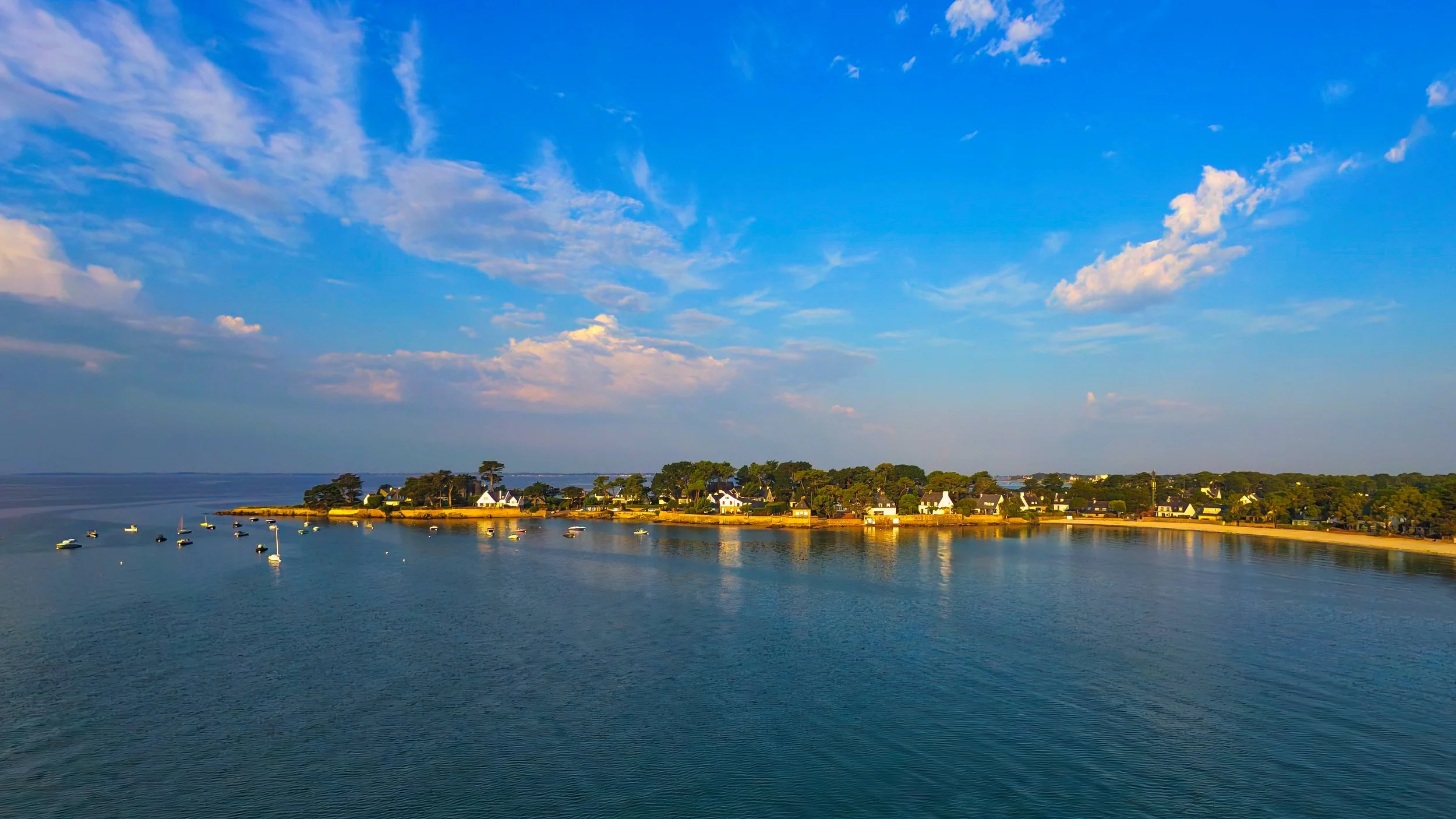 "Beaumer Point" Drone image looking back at Beaumer Point, Carnac, France. With the Sun to our rear, we can see how it is burning the clouds away, revealing another new day. The peaceful water drawing you to the seashore. 