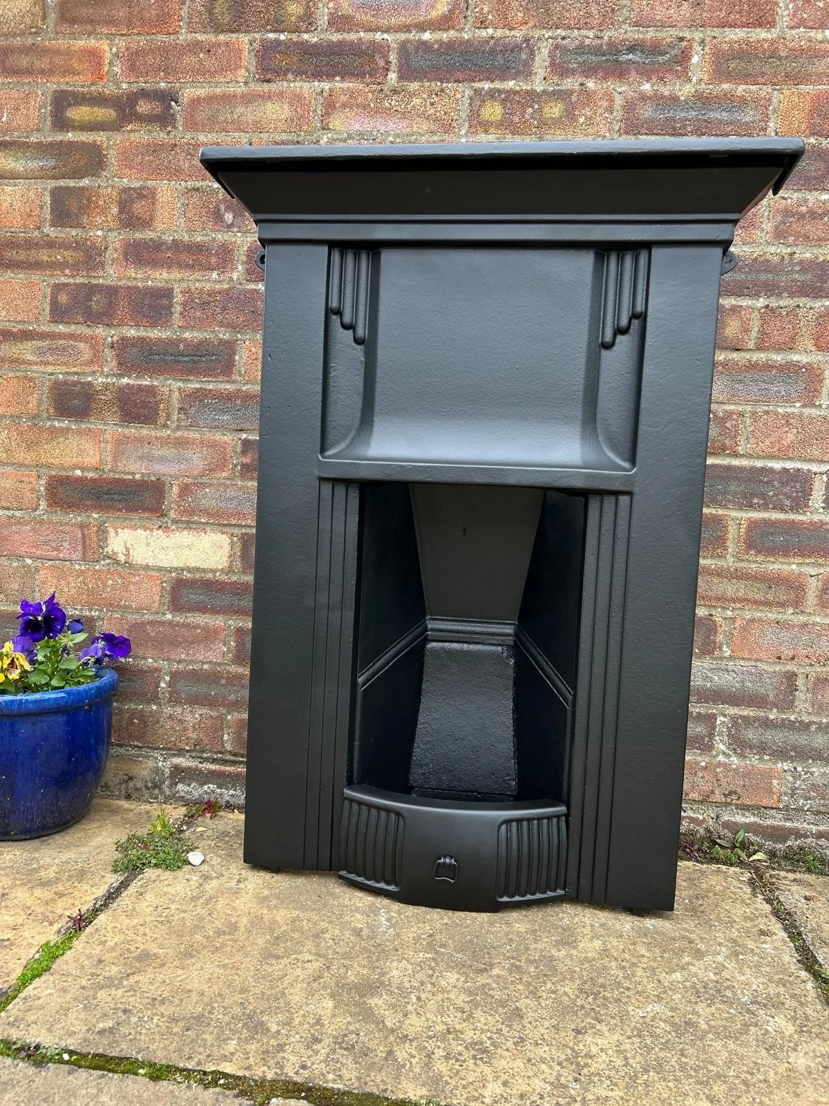 Decorative vintage cast-iron fireplace with unique detailing. Restored by hand to be added to your home.