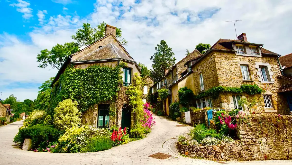 Image showing beautiful stone cottages and flowers in Saint Céneri le Gérei