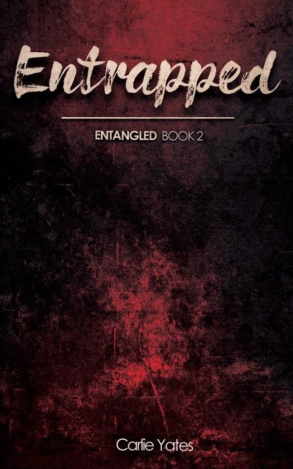 Red book cover reading "Entrapped" line "Entangled Book 2"  Author's name "Carlie Yates" at bottom.