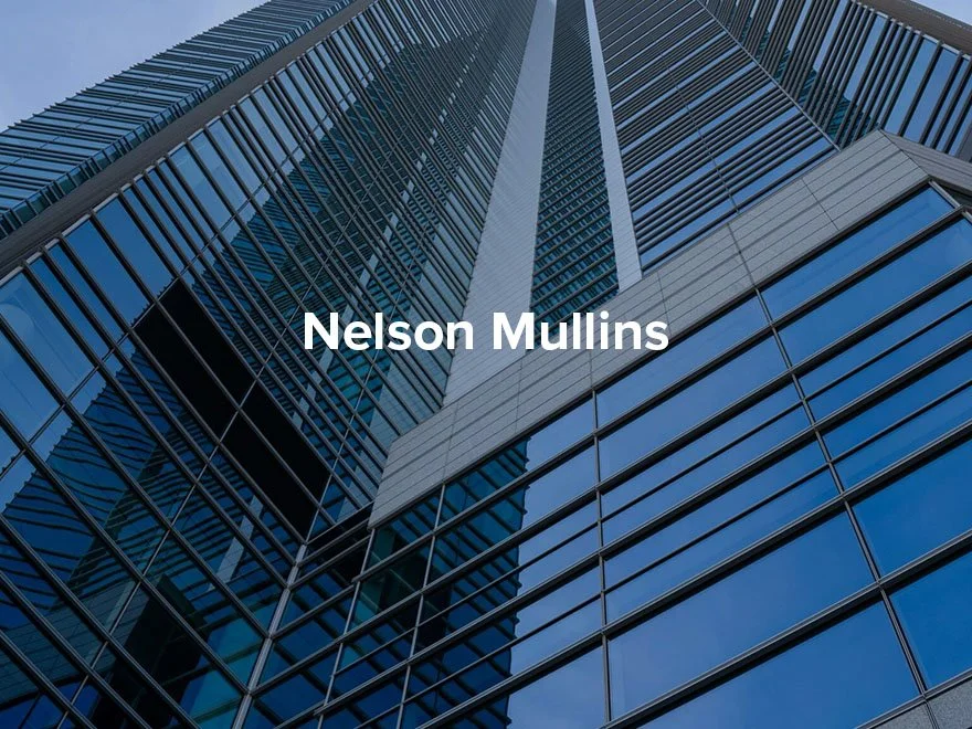 View of a tall modern glass skyscraper from ground level, looking up at the building with reflections of the sky on its windows, and the text "Nelson Mullins" overlaid.