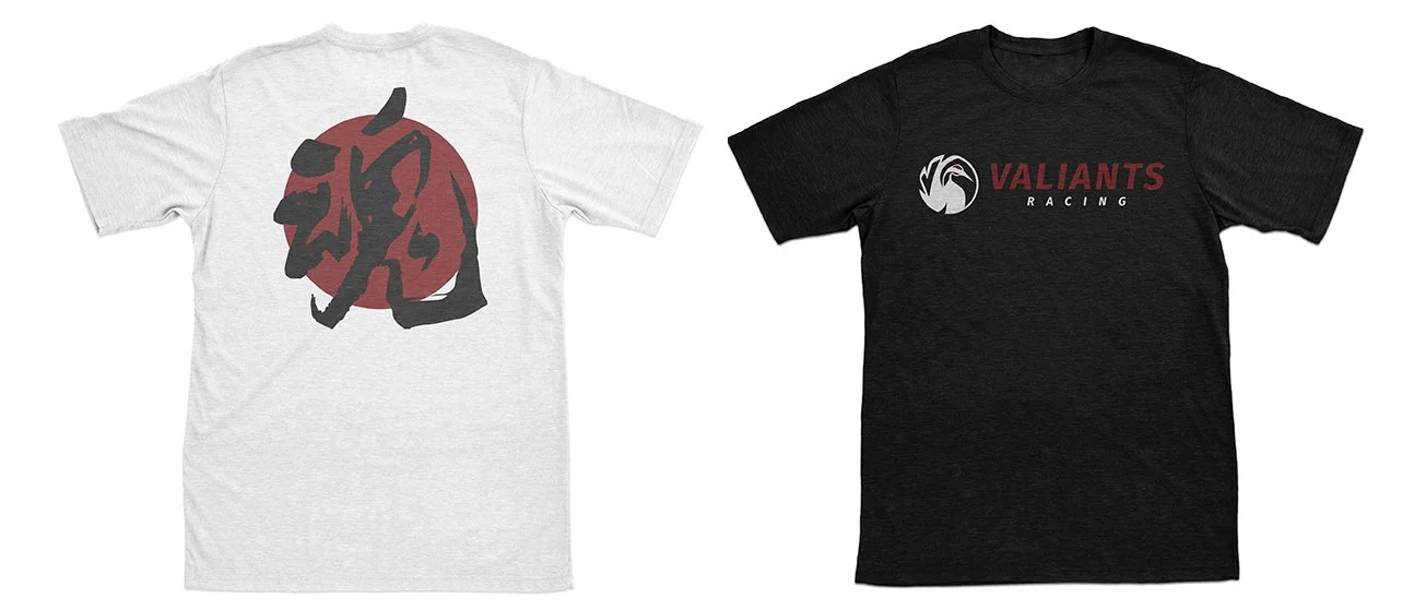 Two T-shirts, one white with a black and red stylized graphic of a lion's head on the back, and one black with a logo of a lion's head inside a circle with the text "VALANTS RACING" on the front.